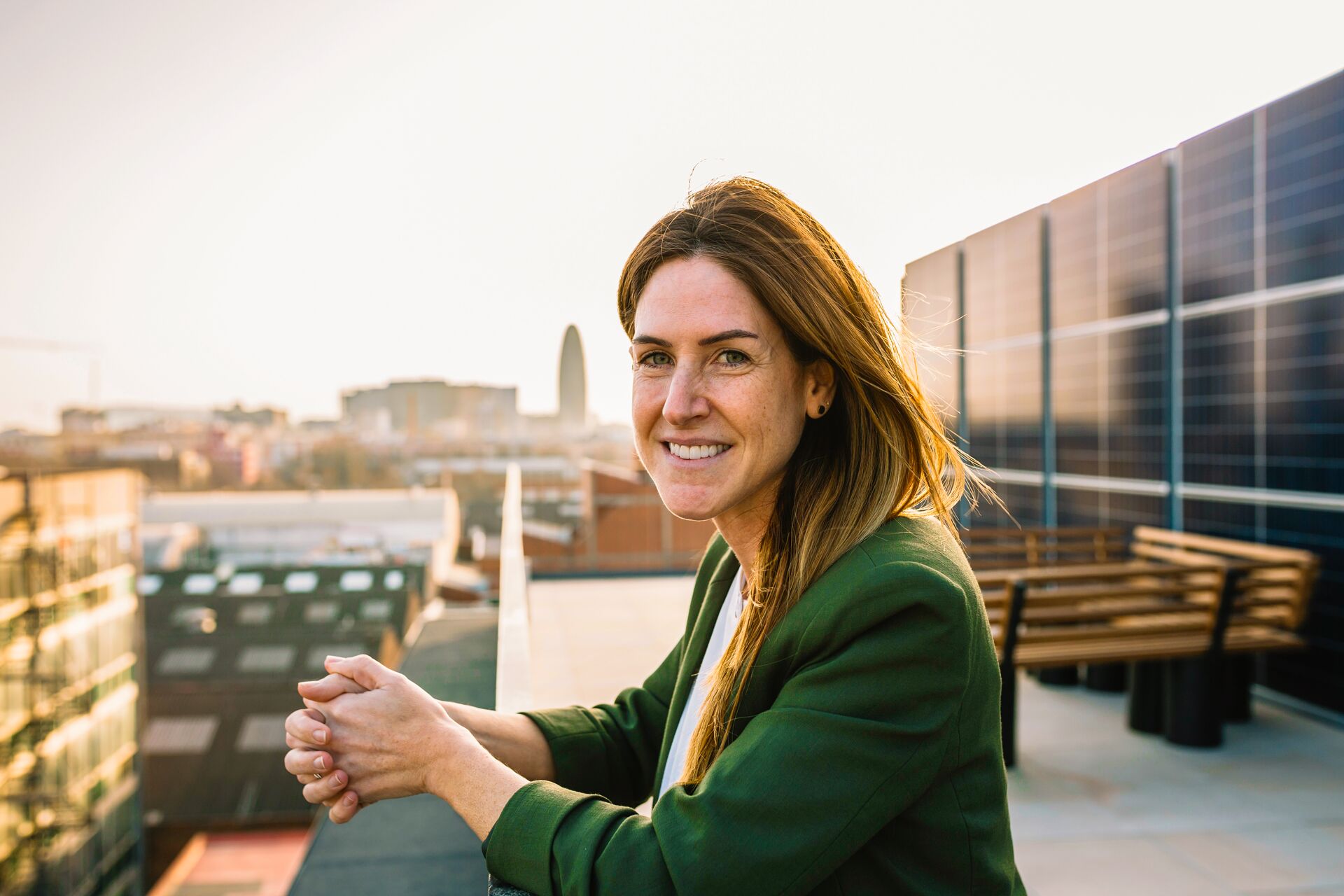 Large MS PPT Web Mid adult woman looking to camera on the top of an office building 2